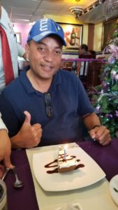 Belize expat having dessert - Belize retirement real estate attorney