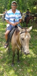 Belize expat on a donkey - Belize retirement real estate attorney